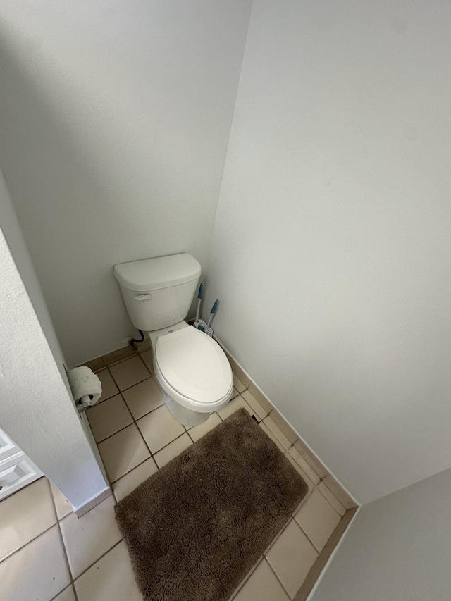 bathroom with tile patterned floors and toilet