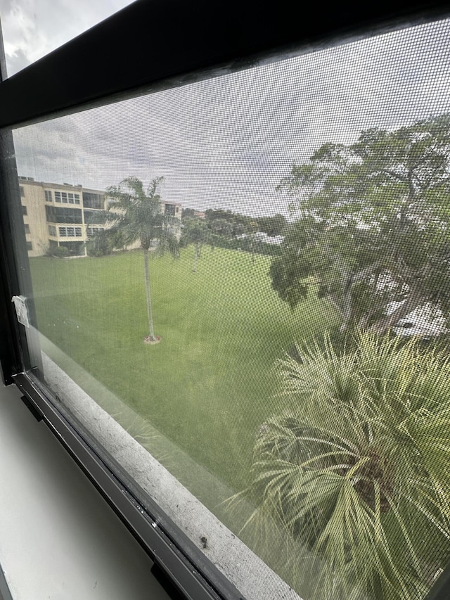 view of yard with a balcony