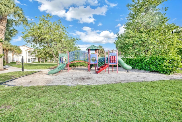 view of playground with a lawn