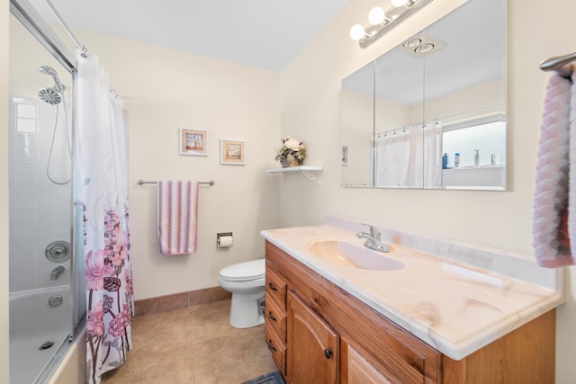 bathroom with tile patterned flooring, toilet, vanity, baseboards, and shower / bath combination with curtain