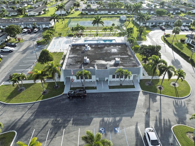 birds eye view of property with a residential view