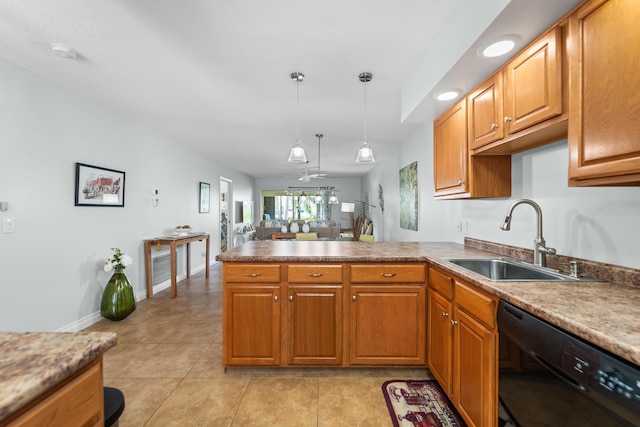 kitchen featuring black dishwasher, baseboards, a peninsula, hanging light fixtures, and a sink