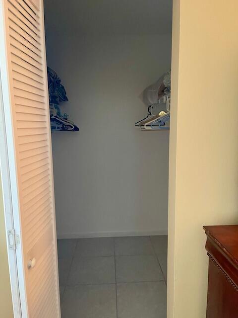 spacious closet featuring tile patterned floors