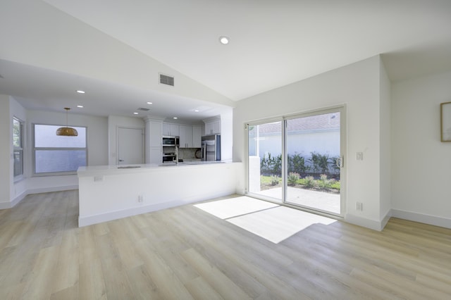 unfurnished living room featuring recessed lighting, visible vents, light wood-style flooring, high vaulted ceiling, and baseboards