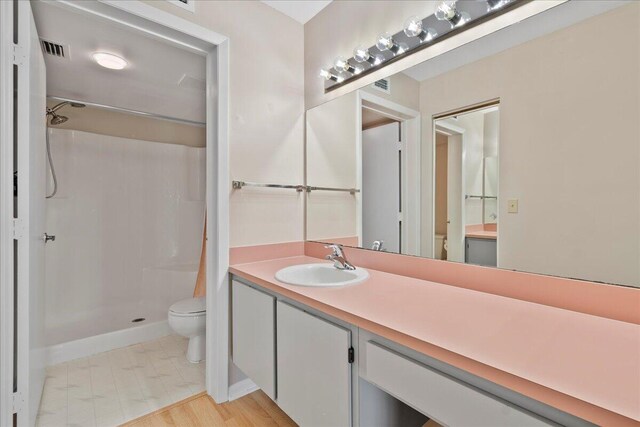 laundry area featuring stacked washing maching and dryer, baseboards, and laundry area