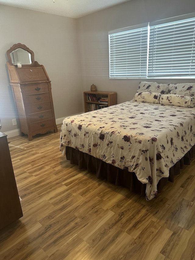 bedroom with hardwood / wood-style flooring