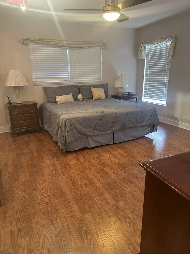 bedroom with hardwood / wood-style flooring and ceiling fan