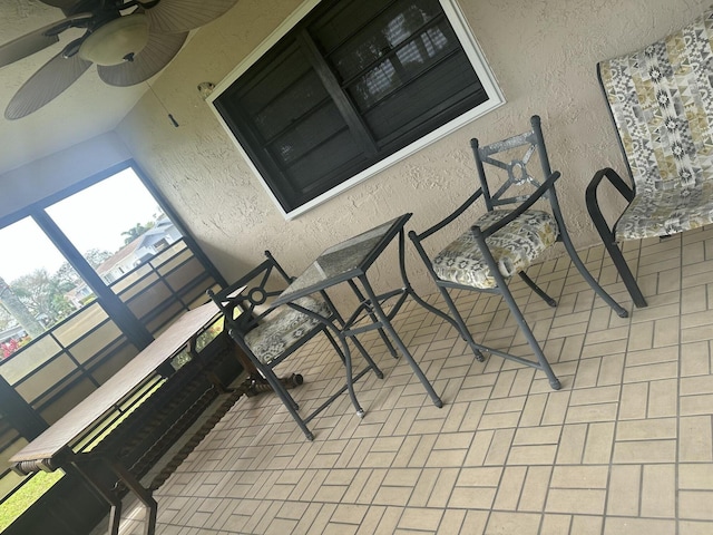 balcony featuring ceiling fan