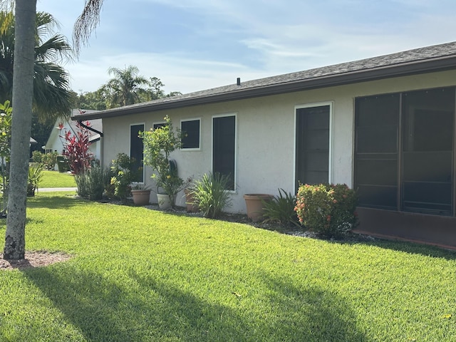 3482 Amalfi Dr, West Palm Beach, FL 33417 - back of property with stucco siding and a yard