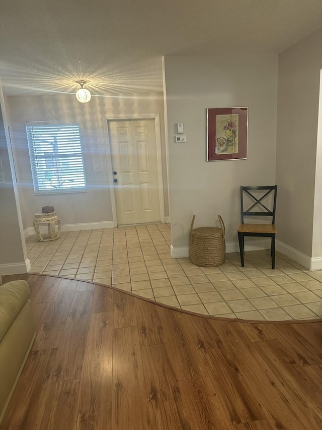 3482 Amalfi Dr, West Palm Beach, FL 33417 - tiled entryway featuring baseboards and a textured ceiling