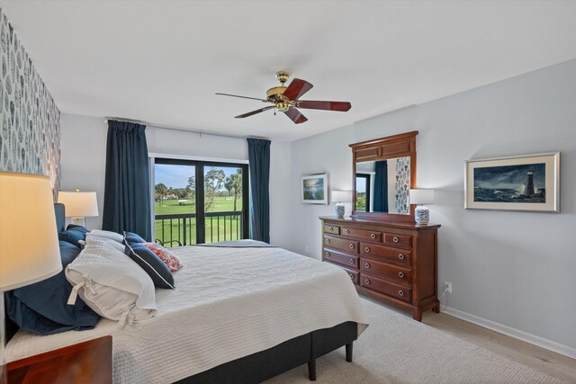 bedroom with access to exterior, ceiling fan, and baseboards