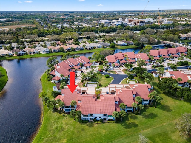 birds eye view of property with a residential view and a water view