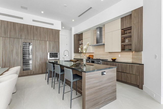 kitchen featuring open shelves, wall chimney range hood, and modern cabinets