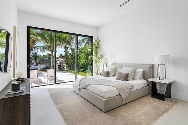 bedroom featuring access to outside, baseboards, and recessed lighting