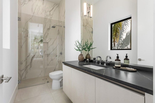 bathroom featuring vanity, a marble finish shower, toilet, and tile patterned floors