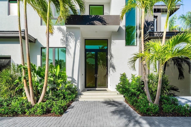 doorway to property with stucco siding