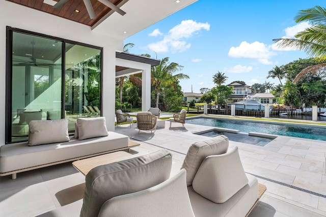 view of patio / terrace featuring outdoor lounge area, a ceiling fan, and an outdoor pool