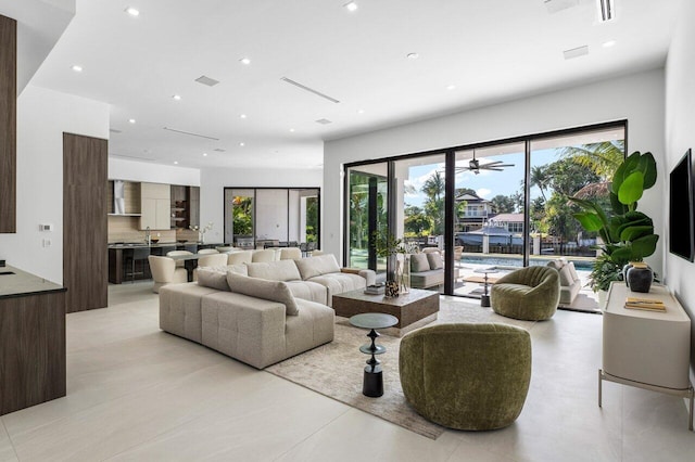 living area with visible vents and recessed lighting