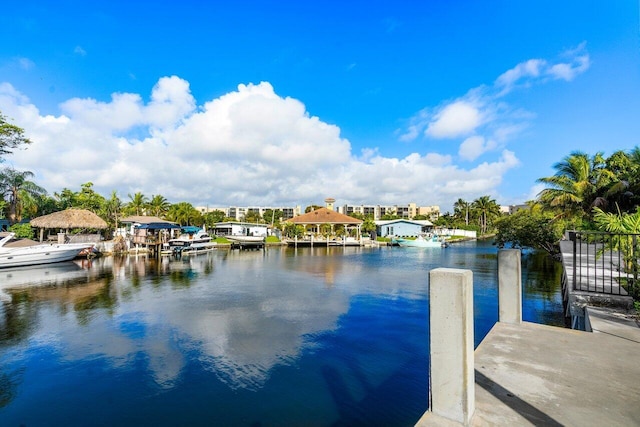 view of dock featuring a water view and a gazebo