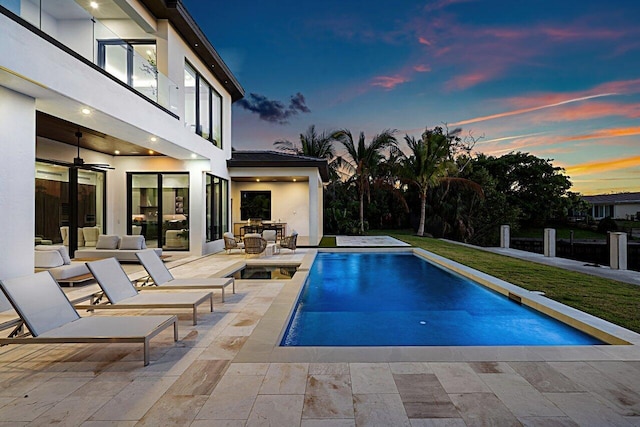 pool featuring a patio area and a ceiling fan