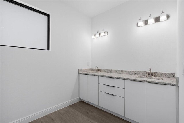 604 Lake Ave, Lehigh Acres, FL 33972 - bathroom with hardwood / wood-style flooring and vanity