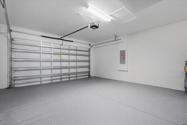 604 Lake Ave, Lehigh Acres, FL 33972 - garage with electric panel and a garage door opener
