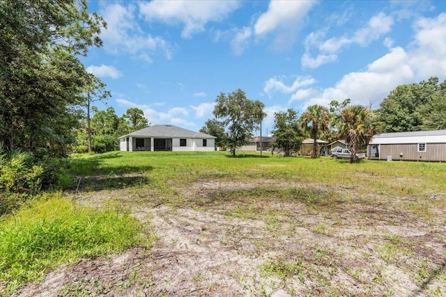 604 Lake Ave, Lehigh Acres, FL 33972 - view of yard