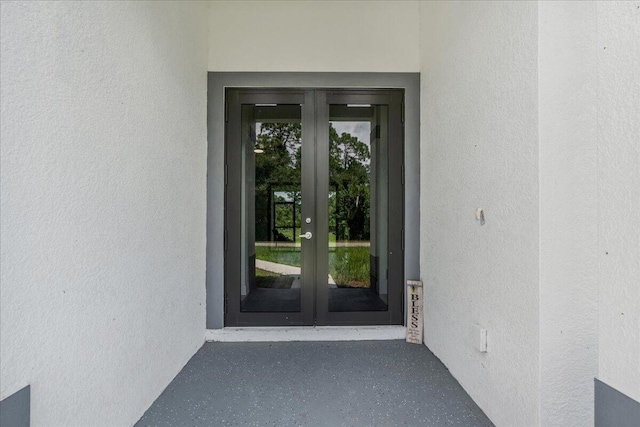 604 Lake Ave, Lehigh Acres, FL 33972 - doorway to property featuring french doors