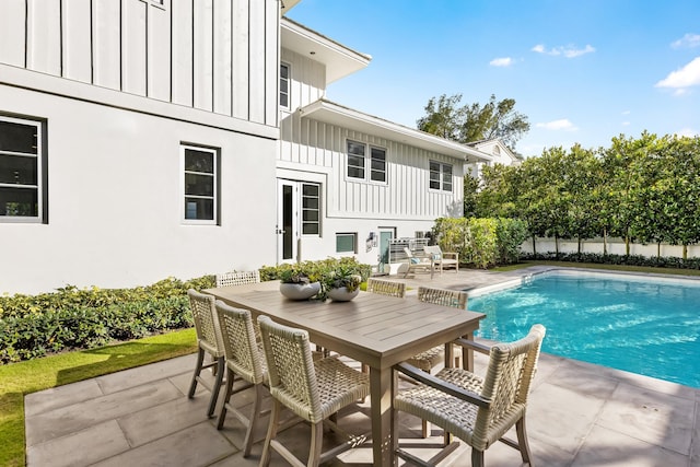 view of swimming pool with a patio