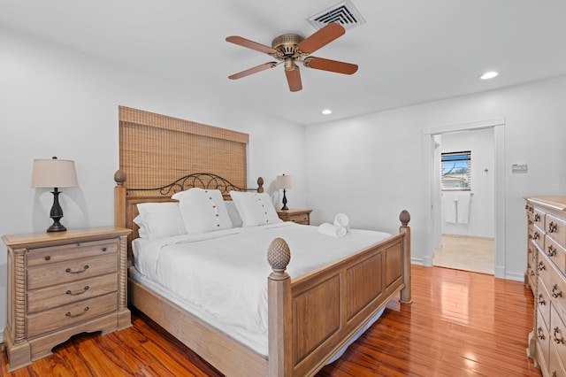 bedroom with hardwood / wood-style flooring and ceiling fan