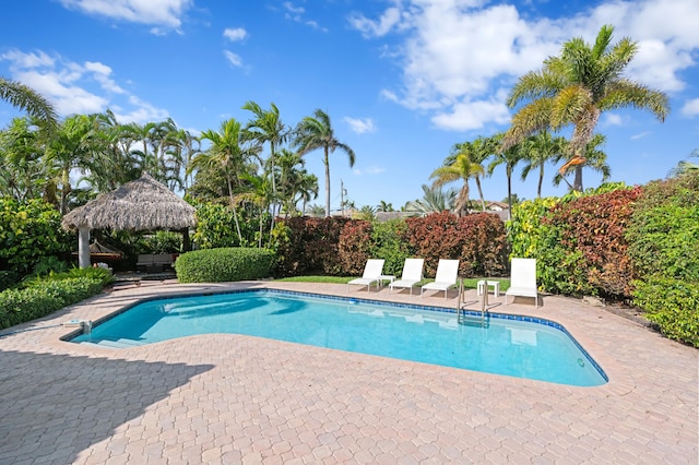 view of pool featuring a gazebo, a patio area, and a fenced in pool