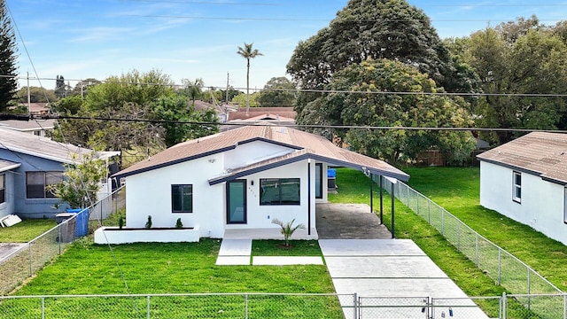 view of front of property with a fenced front yard, driveway, a gate, stucco siding, and a front lawn