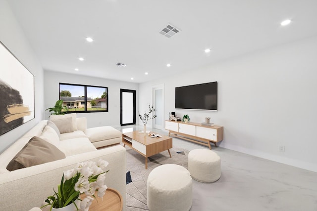 living area featuring baseboards, visible vents, and recessed lighting