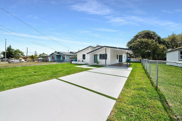 view of front of house featuring a front yard and fence private yard