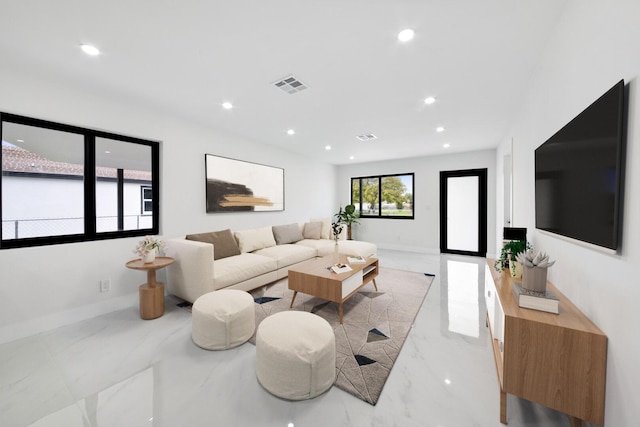 living room with recessed lighting, marble finish floor, visible vents, and baseboards