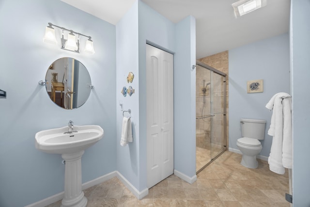 bathroom featuring toilet and walk in shower