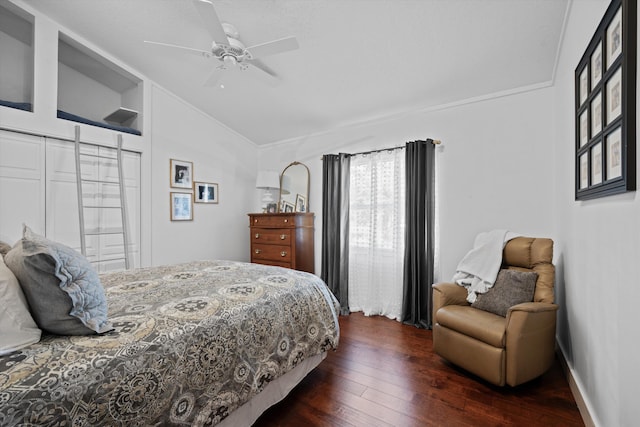 bedroom with lofted ceiling, ceiling fan, and dark hardwood / wood-style floors