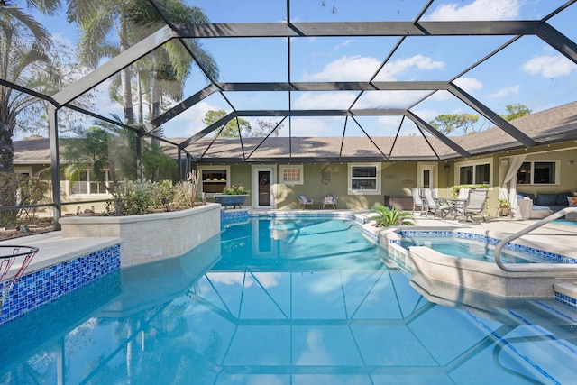 view of swimming pool with a patio area, an in ground hot tub, and a lanai