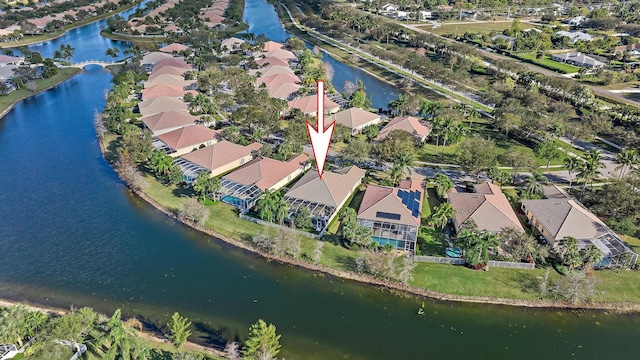 drone / aerial view featuring a residential view and a water view