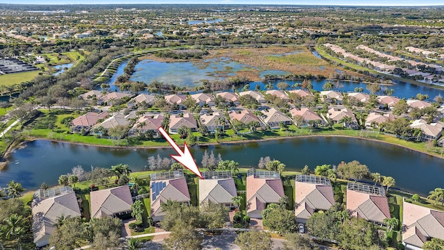 aerial view with a water view and a residential view