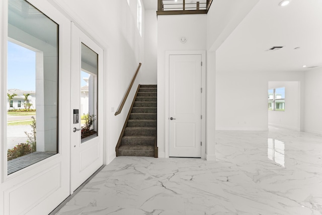 entrance foyer featuring marble finish floor, stairway, visible vents, and recessed lighting