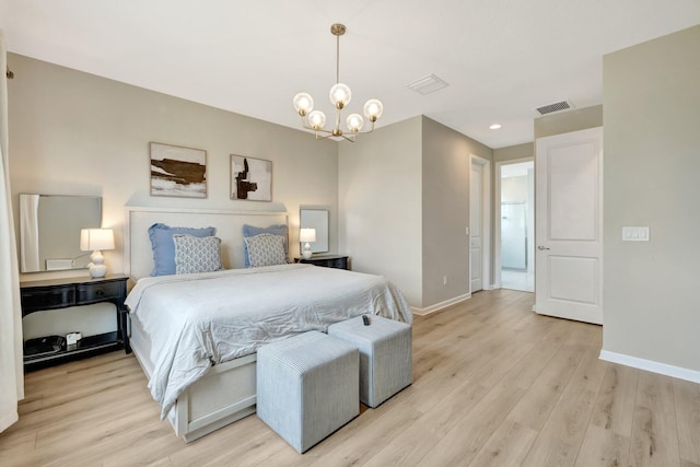 bedroom featuring visible vents, an inviting chandelier, light wood-style flooring, and baseboards