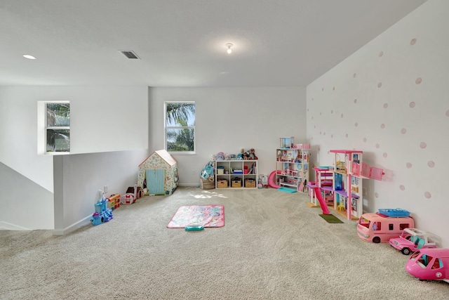 game room with carpet flooring and visible vents