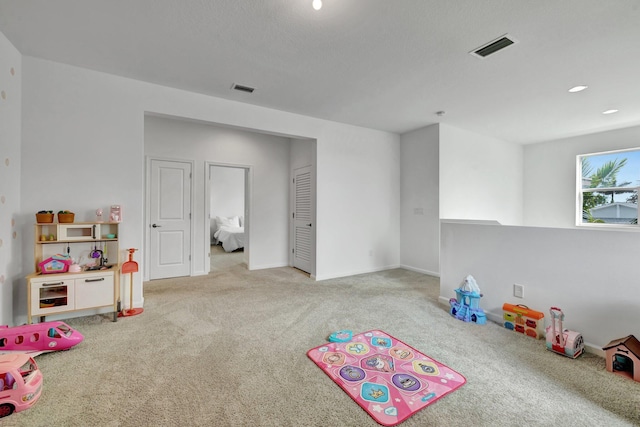 game room featuring carpet flooring, visible vents, and baseboards