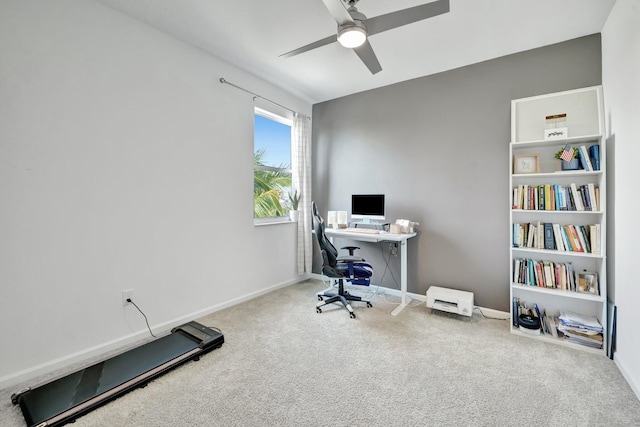 office featuring carpet floors, ceiling fan, and baseboards