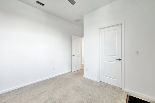 unfurnished bedroom featuring carpet, visible vents, ceiling fan, and baseboards