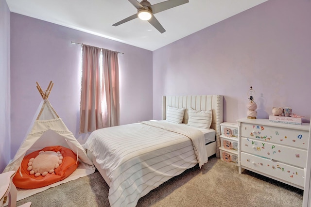 bedroom featuring light colored carpet and ceiling fan