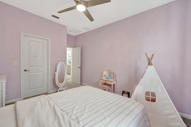 carpeted bedroom featuring visible vents, baseboards, and a ceiling fan