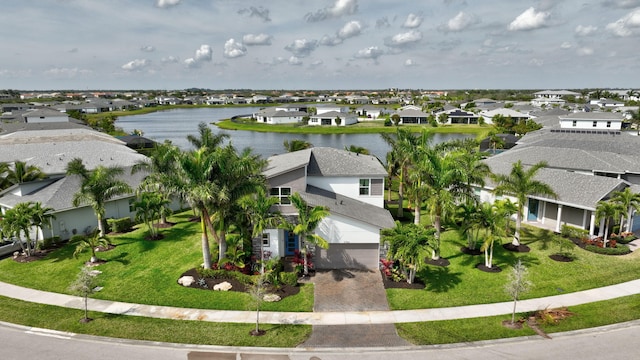 bird's eye view with a residential view and a water view