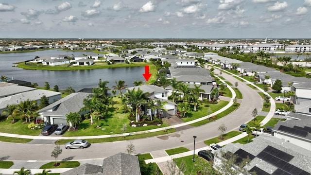 bird's eye view with a residential view and a water view